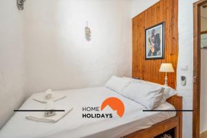 Giường trong phòng chung tại #237 Vivenda Lilia by Home Holidays +44 ảnh