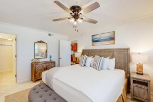 a bedroom with a bed and a ceiling fan at Pinnacle Port C2-404 in Panama City Beach +38 photos
