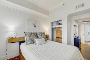 a bedroom with a bed with a white bedspread at Misty Morning in Sugar Mountain +32 photos