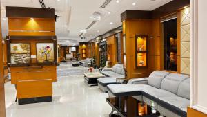 a lobby with couches and tables in a building at رفا للشقق المخدومة-اقتصادي in Riyadh