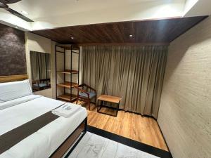 Postel nebo postele na pokoji v ubytování Hotel Keys Delight + 24 fotografií