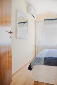 a bedroom with a bed and a window at Green Zelina in Šulinec