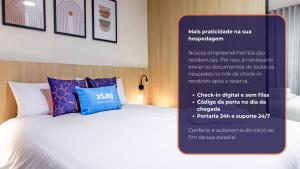 a poster of a bed in a hotel room at Fuji By Xtay Florianópolis - Estúdios aconchegantes e completos no Centro Sul in Florianópolis +63 photos