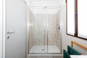 a shower with a glass door in a bathroom at La casa nel verde di Francesco in Lipomo +29 photos