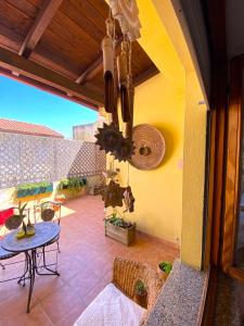 an outdoor patio with a table and a tableablish at City House Cagliari in Cagliari