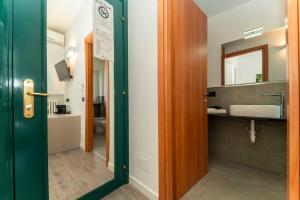 a bathroom with a sink and a mirror at Inv Solution in Turin