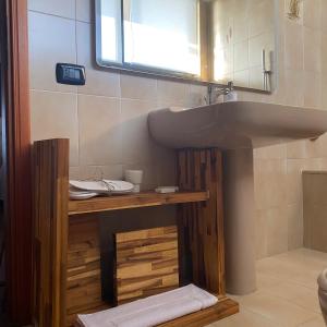 a bathroom with a sink and a mirror at Civico 48 in Vizzola Ticino