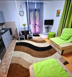 a living room with a couch and a rug at Eco Bay Montenegro in Donji Morinj