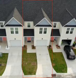 an aerial view of a house with a garage at Tide's Turn Retreat in Cedar Point