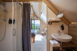 a bathroom with a sink and a shower at Glamping Stregaia in Massa Marittima +56 photos