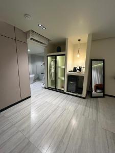 an empty room with a large room with a bathroom at ovation Studio in Riyadh
