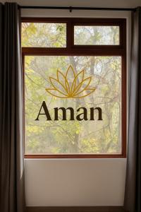 a window with an amazon sign on it at Casona San Cayetano Suites & Lofts & Spa by SCE in Guanajuato