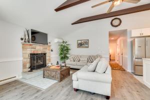 a living room with a couch and a fireplace at Hot Tub and Game Room Wooded Poconos Retreat in Pocono Country Place