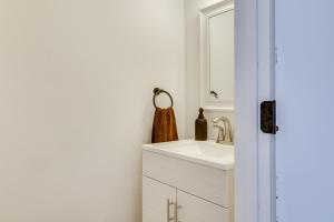 a bathroom with a sink and a mirror at Hot Tub and Game Room Wooded Poconos Retreat in Pocono Country Place +22 photos