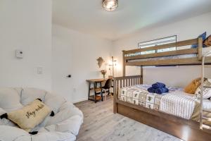 a living room with a bunk bed and a couch at Hot Tub and Game Room Wooded Poconos Retreat in Pocono Country Place