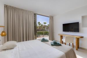 Ένα ή περισσότερα κρεβάτια σε δωμάτιο στο SALGADOS BEACH VILLA by My Algarve Rentals +61 φωτογραφίες