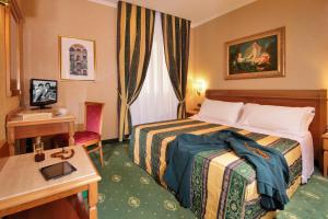 Postel nebo postele na pokoji v ubytování Colonna Hotel + 37 fotografií