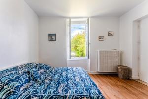 Un ou plusieurs lits dans un hébergement de l'établissement Maison Badet - Salles