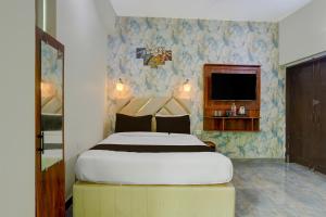 Katil atau katil-katil dalam bilik di Townhouse OAK Hotel Dream Palace