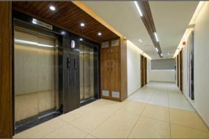 an empty hallway of a office building with a elevator at Hotel O Rajula Formerly The Urban Hotel in Rājula +6 photos