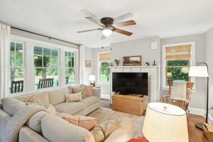 a living room with a couch and a flat screen tv at Badby Wood Farmhouse 3BR 3BA Fauquier County in Marshall