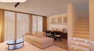 una sala de estar con un sofá y una mesa en Casa Blanc - Coastal Triplex, en Blankenberge