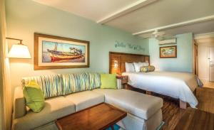 a hotel room with a couch and a bed at Margaritaville Vacation Club - St Thomas in Frydendal +60 photos