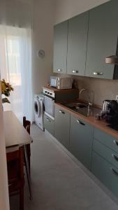 Kuchyň nebo kuchyňský kout v ubytování Casa Vacanza Elena