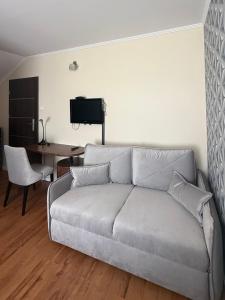 a living room with a couch and a table at Laura in Bełchatów