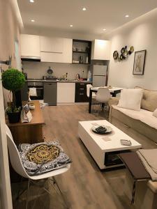 a living room with a couch and a table at Nina Urban Apartment-Novi Beograd in Belgrade