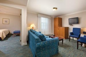 a hotel room with a couch and a bed at Inn at the Opera in San Francisco