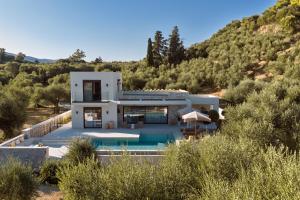 a villa with a swimming pool in the hills at Alba d'Oro in Laganas