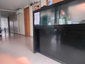 a large black display case in a room with at Collection O Paithan Gate Formerly Rajlaxmi Executive in Aurangabad