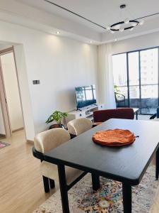 a room with a table and a living room at Raydil Homes in Nairobi