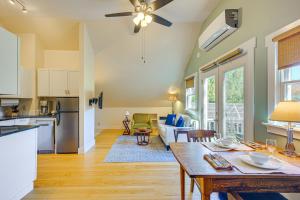a kitchen and living room with a table and a couch at Romantic, Secluded Vermont Getaway with Hot Tub in Hancock