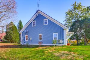 a blue house with a gambrel at Romantic, Secluded Vermont Getaway with Hot Tub in Hancock