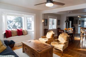 a living room with a couch and a table at Blueberry bungalow near DeerValley sleeps5 pets in Heber City