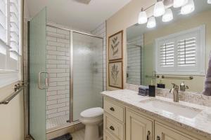 a bathroom with a toilet and a sink and a shower at Cottage on the hill sleeps 6 views gym office in Parkview Trailer Court +25 photos