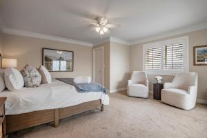 a bedroom with a bed and a ceiling fan at Cottage on the hill sleeps 6 views gym office in Parkview Trailer Court