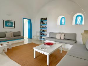 a living room with two couches and a coffee table at Peaceful Haven, Villa Private Rooms, Absolute Quiet in Bin Rhilouf