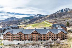 an aerial view of a resort with mountains in the background at Lux Sleeps 4 king bed hot tub views gym in Cranmer
