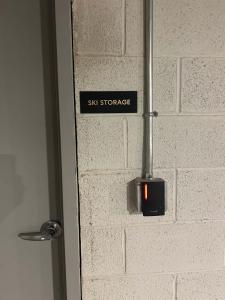 a sign on the side of a brick wall at Lux Sleeps 4 king bed hot tub views gym in Cranmer