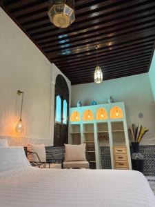 Ένα ή περισσότερα κρεβάτια σε δωμάτιο στο Riad Citronnier