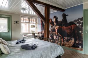 Ένα ή περισσότερα κρεβάτια σε δωμάτιο στο Bed and Breakfast de Hoge Enk