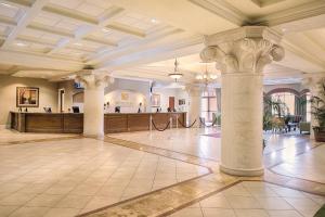 a large lobby with columns and a reception area at Club Wyndham Bonnet Creek in Orlando +127 photos
