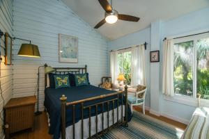 a bedroom with a bed and a window at Shrimpers Cove in Edisto Island