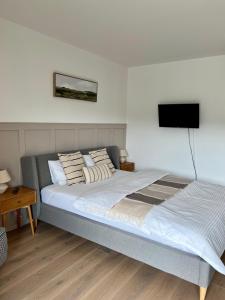 Ένα ή περισσότερα κρεβάτια σε δωμάτιο στο Gartenapartment Mariazell +4 φωτογραφίες