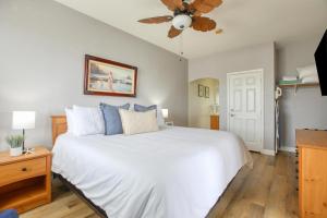 a bedroom with a white bed and a ceiling fan at Pacific Plaza #609 - Offshore Oasis - 1BdrmUp-K-FSofa in Oceano +23 photos