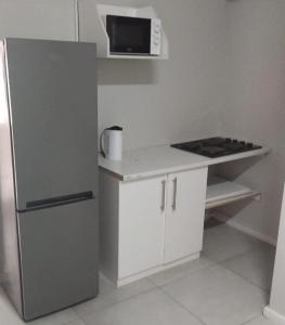 Η κουζίνα ή μικρή κουζίνα στο New Dawn - Beach House