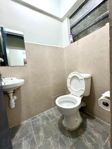 Koupelna v ubytování Queens Stay Apartment + 7 fotografií